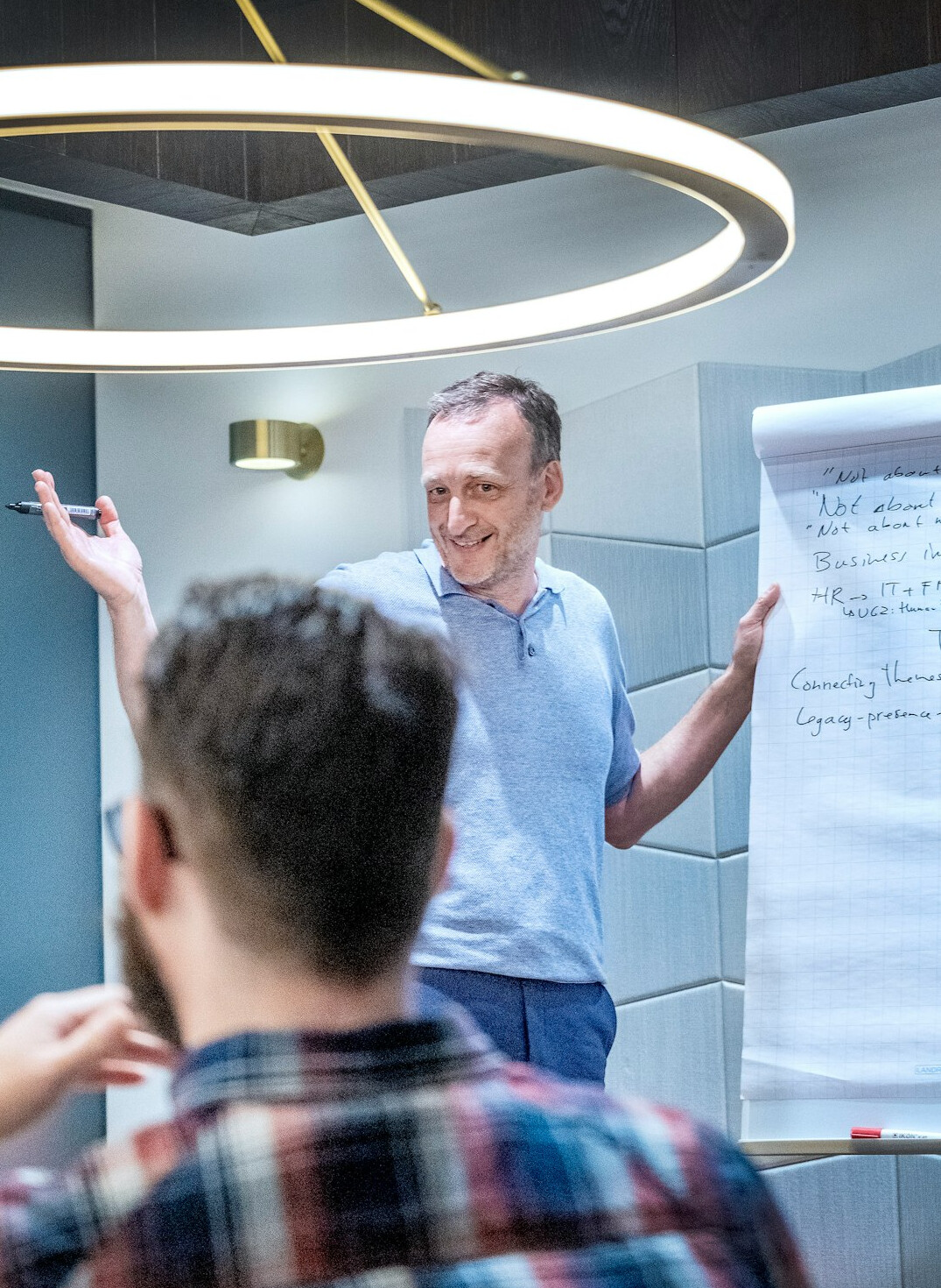 man presenting to colleagues